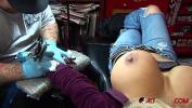 Download vidio Bokep Busty blonde pornstar pulls out her huge tits while getting a tattoo on her wrist
